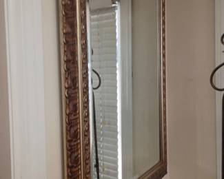 Large ornate framed wall mirror, dark wood frame