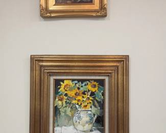 Framed oil paintings in gold frames, dog scene and sunflower still life