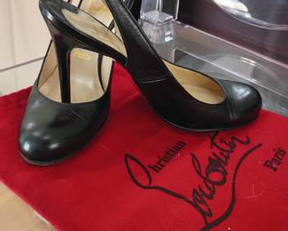 Christian Louboutin black leather slingback heels, designer pumps, red dust bag, luxury high heel shoes, Paris