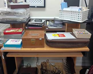 Office desk with supplies, books, desk lamp, storage baskets, stationery lot
