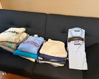 sweatshirs, golf shirts and new dress shirts shown on a Futon - Navy - great for college!