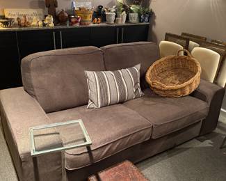 2-cushion couch with wide arms - sleeper sofa, side drink table, leather footstool and large basket