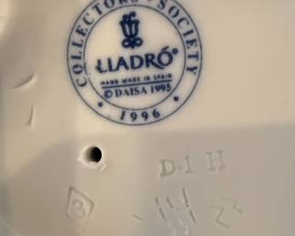 Lladro "Innocence in Bloom" Figurine (7644) and Lladro "Girl with Basket" Figurine (5027)