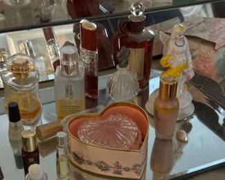 Assorted Vintage Perfume Bottles and HeartShaped Collectible Boxes