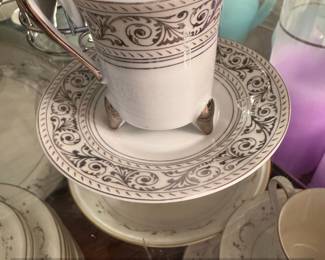 Vintage Porcelain Teacup and Saucer Set with Metal Rack second image