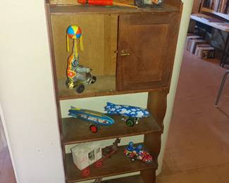 Old tin windup toys on shelf