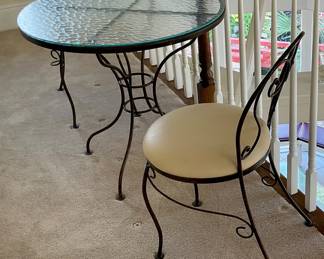 Bistro set table and 2 chairs iron and glass with vinyl seats, 29” round, 28” tall, . Price for set $200