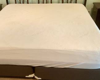 King bed stripped, has a few dark spots on washable cover, foam mattress