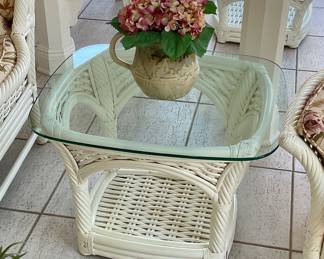 Wicker and glass side table, 27” , 23”, 22” tall. One available