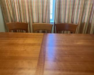 2 chairs were bought later and are are darker shade. Two outside chairs are darker