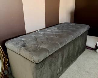 Grey velvet tufter storgae ottoman with chrome nailhead trim