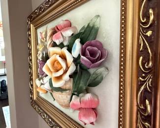 Framed Capodimonte-style porcelain flowers set within gold frame