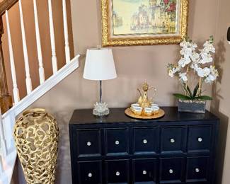 Black 3-drawer accent table 42"w x 1'd x 3'h; 34" Gold Star Floor Vase