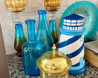 Variety of decorative brass, handblown glass vessels