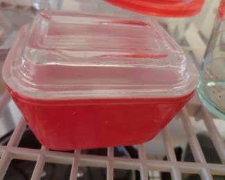 Small red Pyrex refrigerator dish with lid