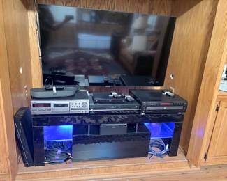 Lighted entertainment center, cassette deck, VCR/VHS combo, multi-disc CD player, smart TV, blink cameras, turntable