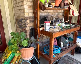 Loppers, trimmers, potting soil, terra cotta pots, potting bench (custom handmade!), trimmers, trowels, hoses