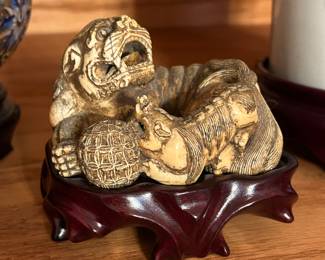 Carved ivory
Netsuke shishi