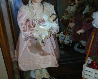 pink dress doll with baby doll $35
