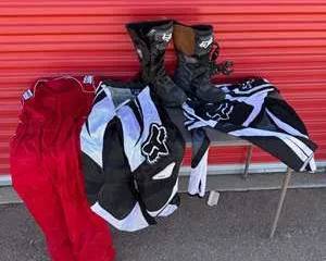 Youth Sized Motocross Riding Gear Set with Fox Racing Boots, Jersey, Pants, and Red Racing Suit