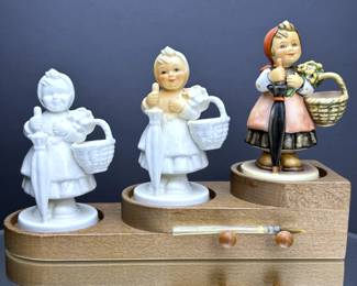 Limited edition of Hummel 350 On Holiday that displays a progression of hand painting on three examples of the On Holiday figurine.   It is number 190 of 1,000