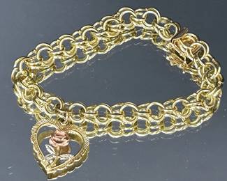 Vintage 14k yellow gold bracelet with 14k yellow gold charm with rose gold flower petals 