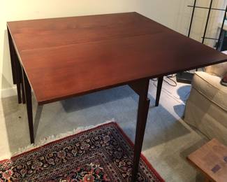Rosewood table with one leaf up (each leaf is 22”)