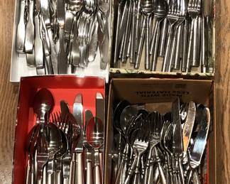 Several sets of stainless flatware