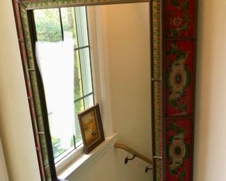Peruvian mirror with reverse painted glass frame (23.5” x 31.5”)