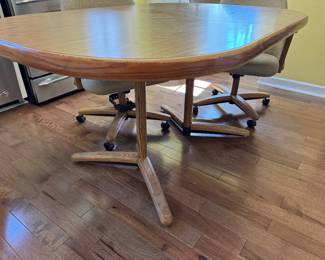 Vintage extension dining table with 7 rolling chairs - 5 arm - 2 sides 