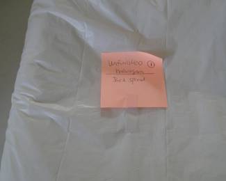 Unfinished monogramed bed spread