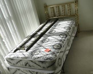 We actually have two twin beds, with brass headboards, and a complete mattress, and box spring set too