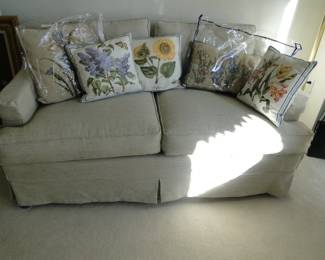Floral pillows, on a nice neutral sofa