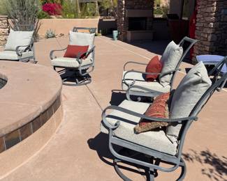 Four swivel and rocking outdoor chairs, cushions and near perfect condition