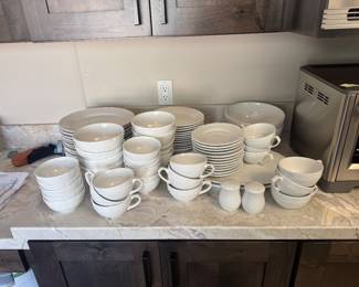 Large set of white dishes does not include the cups and saucers