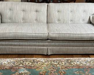 A tailored mid century sofa