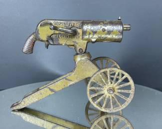Antique rapid fire machine gun toy