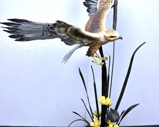 Boehm Porcelain Marsh Harrier with Water lilies (Bronze). It is number 82 out of a limited edition in 1983. Boehm Studios was founded by Edward Marshall Boehm (1913 -1969) a ‘naturalist farmer’ in 1950. The Boehm legacy was carried on by his wife and business partner, Helen Boehm after his passing. Based in Trenton New Jersy, Boehm Porcelain built up a reputation for remarkable porcelain sculpture art. Boehm’s reputation excelled after the Metropolitan Museum of Art purchased his first sculptures. His work was purchased by President and Mrs. Eisenhower to present Boehm porcelain as gifts for visiting Heads of State. This culminated in Boehm receiving a commission to create ‘Prince Philip on His Polo Pony’. It was presented to Queen Elizabeth and Prince Philippe in 1957. Since then, the Royal Family have acquired several examples of Boehm porcelain.