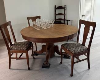 Antique claw foot table with 2 leaves. 3 clawfoot chairs. Etched glassware
