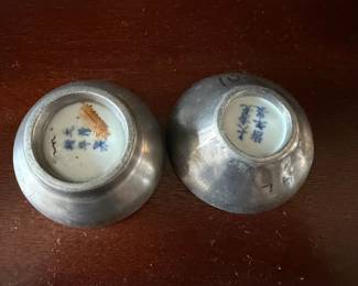 Bottom of Oriental dishes in pewter