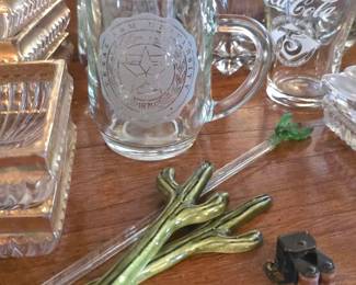 glass stir sticks and a curio full of sparkling glass