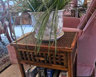 Rattan occasional, ceramic planter, books