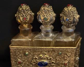 Antique perfume bottles and bejeweled caddy probably from France or Czechoslovakia 