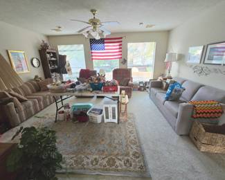 Large gameroom full of toys, household decorations, 2 recliners, 2 sleeper sofas