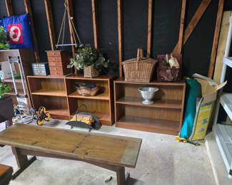 A selection of wooden bookshelves and overflow decor items