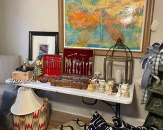 Flatware, ottoman, rug, designer pillows