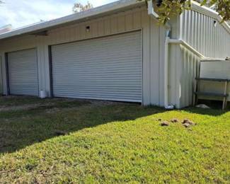 2+ car garage, 2 doors in front, one in back of garage. One walk-in door on front and back of garage 