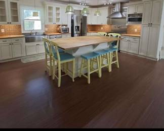 Chef's kitchen!  36" propane stove, farmhouse sink, butcher block counters and huge island.  Lots of cupboards for storage and huge pantry 