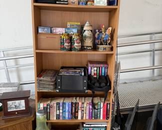 romance novels, cookbooks, dvds, music box, tins, trinkets