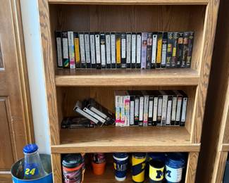 circa 1990s playboys, X-rated VHS tapes, sports mugs and nascar trash can